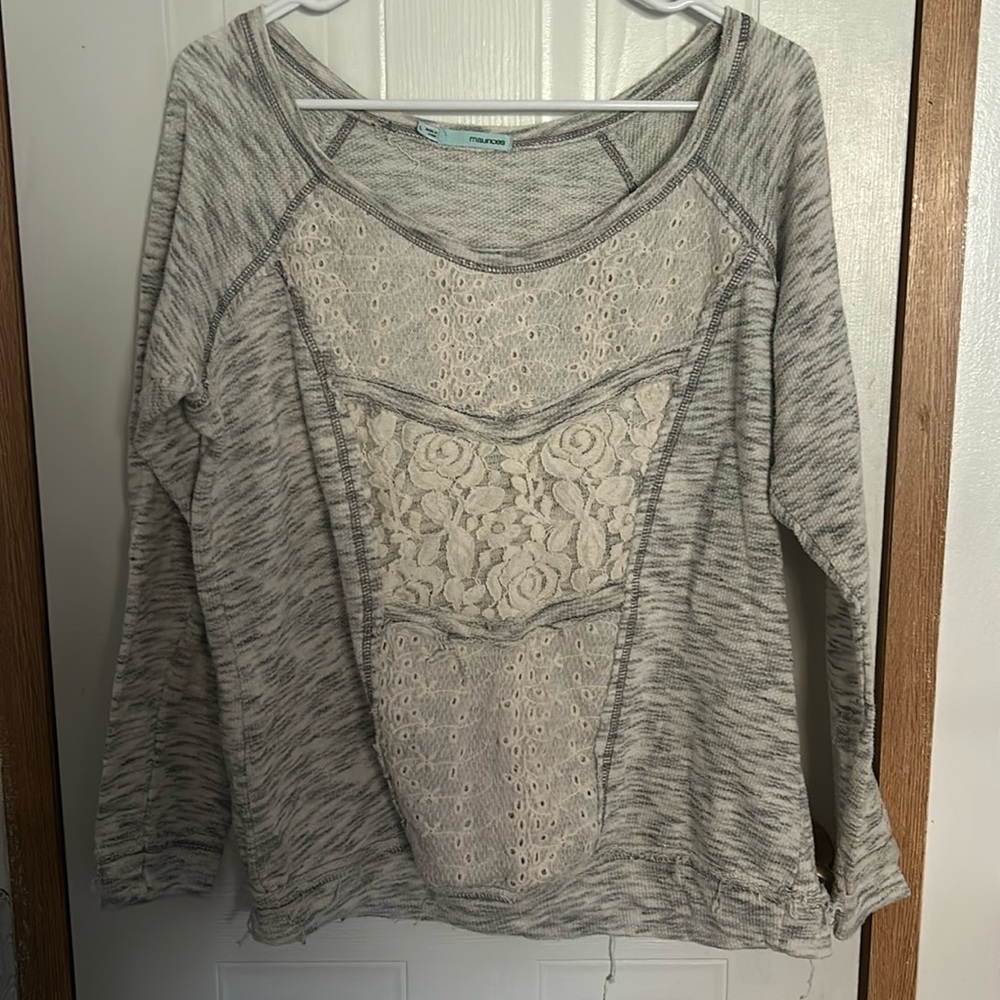A grey, long sleeved top